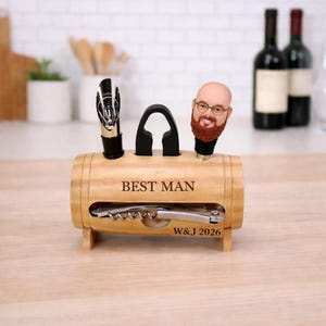 Könnte beinhalten: Ein Set aus drei Keramikbechern mit gesprenkelter, matter Oberfläche. Die Becher sind in Creme-, Hellgrau- und Dunkelgrautönen gehalten. Jeder Becher hat ein schlichtes, minimalistisches Design, ideal für Kaffee oder Tee.