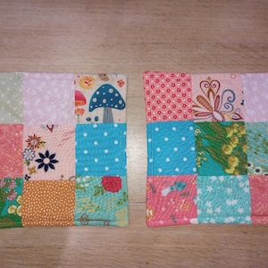 May include: A white ceramic mug with a black handle and the text "But First, Coffee" in a bold, black font. The mug is set against a blurred background, highlighting its clean design.