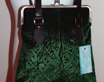 A deep bottle green Velvet Handbag with a Handprinted  Celtic Design and Leather Handles