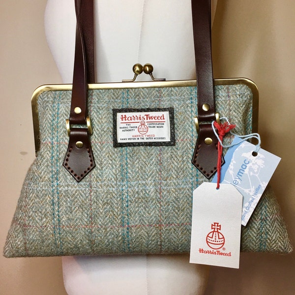 Scottish Harris Tweed kisslock handbag in a light duck egg green herringbone pattern with leather handles