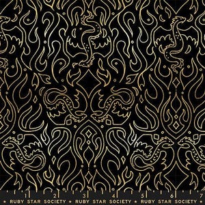 May include: A black fabric featuring a repeating gold line art pattern of stylised dragons and flame motifs. A ruler at the bottom edge shows measurements in inches, with the text Ruby Star Society printed repeatedly along the bottom margin.