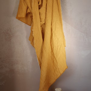 Lightweight linen blanket with  fringe around in mustard color