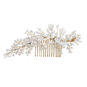 May include: A gold hair comb adorned with white pearl and crystal embellishments. The comb features a floral design with delicate branches and leaves.