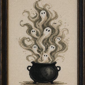 May include: A framed cross-stitch embroidery featuring a black cauldron at the bottom with swirling, smoke-like grey and beige vapour rising upwards. Several small, white ghost figures with simple black eyes are embedded within the smoke.