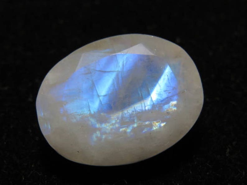 Oval Shape Cut Stone Size Rainbow Moonstone weight 10.70 crt Good Quality 12x15 mm Faceted Both Side