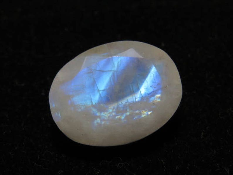 Oval Shape Cut Stone Size Rainbow Moonstone weight 10.70 crt Good Quality 12x15 mm Faceted Both Side