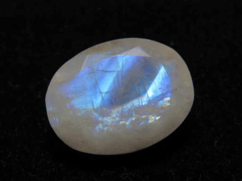 Oval Shape Cut Stone Size Rainbow Moonstone weight 10.70 crt Good Quality 12x15 mm Faceted Both Side