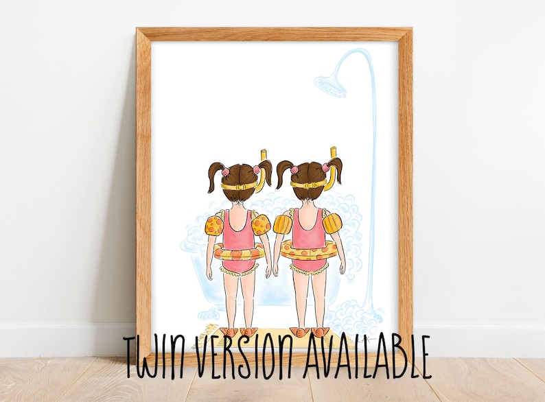 May include: Watercolor illustration of two girls in pink swimsuits, yellow arm floaties, and swim rings, standing in a bathtub under a shower. The artwork is framed in a light brown wooden frame. Text at the bottom reads "TWIN VERSION AVAILABLE".