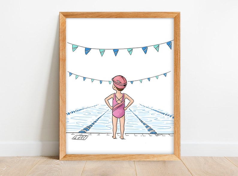 May include: A framed illustration of a swimmer in a pink swimsuit and cap, standing at the edge of a pool. Blue and teal pennants hang above the pool. The artwork is in a wooden frame.