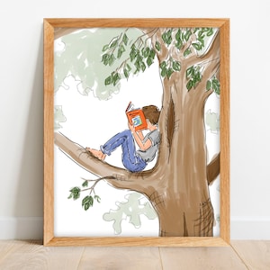 May include: A framed art print depicts a child reading a book while perched on a tree branch. The illustration features a brown tree trunk, green leaves, and a child wearing blue jeans and a gray shirt.