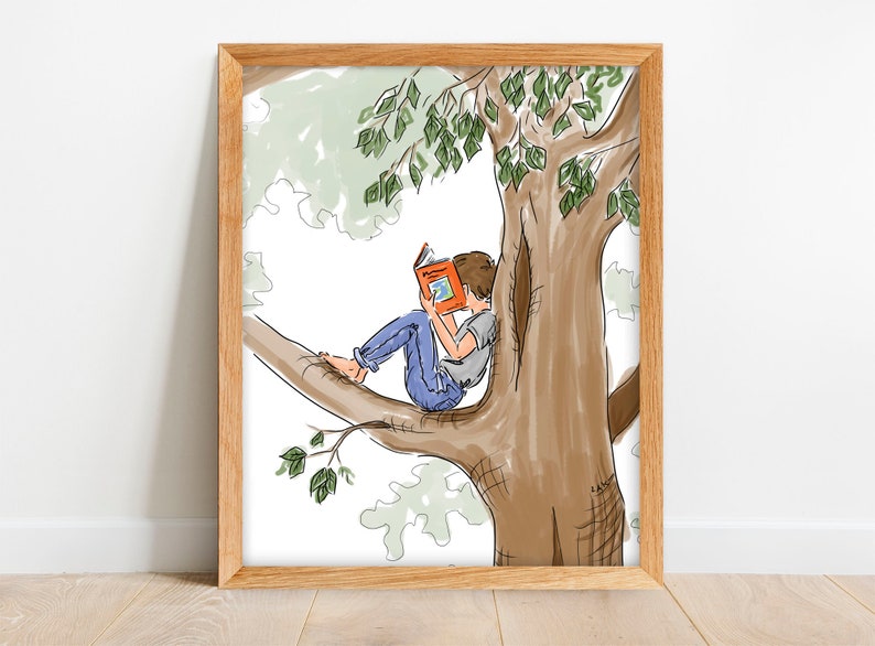 May include: A framed art print depicts a child reading a book while perched on a tree branch. The illustration features a brown tree trunk, green leaves, and a child wearing blue jeans and a gray shirt.