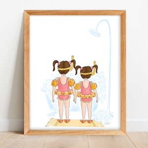 May include: Watercolor illustration of two young children in swimsuits, snorkels, and arm floaties, standing under a shower. They are wearing pink swimsuits and yellow and orange floaties. The artwork is framed in a light wood frame.
