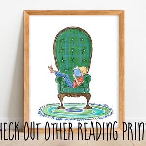 May include: Watercolor print of a person reading a book while reclining in a green plaid armchair. The chair sits on a round rug with blue and green accents. The framed artwork includes the text "CHECK OUT OTHER READING PRINTS".