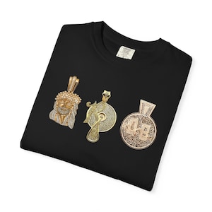 May include: Black t-shirt with three gold and diamond encrusted pendants. The pendants are a Jesus head, a record player, and a money bag.