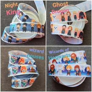 May include: Four spools of decorative ribbon featuring cartoon characters and text. The ribbons include designs with the words "Night King", "Ghost Drogon", "wizard houses", and "Wizards of Hogwarts". The ribbons are white with colorful illustrations.