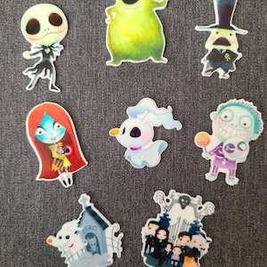 May include: Nine colorful stickers featuring characters from the Nightmare Before Christmas. The stickers include Jack Skellington, Sally, Oogie Boogie, Zero, the Mayor, and the citizens of Halloween Town.