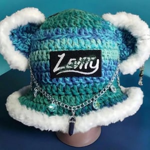 May include: A set of three ceramic mugs with a speckled, matte finish. The mugs are in shades of cream, light gray, and dark gray. Each mug has a simple, minimalist design, perfect for coffee or tea.