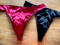 Black & Ruby red male satin thong. Available in size 28”- 38” waist.