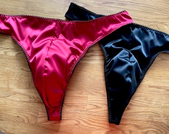 Black & Ruby red male satin thong. Available in size 28”- 38” waist.