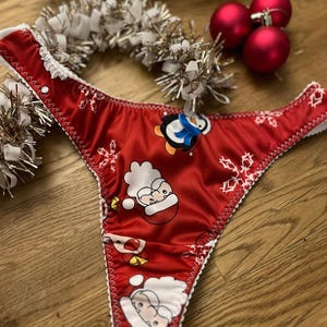 Christmas gift ideas for her. Womens Red and white festive thong with see through mesh rear in sizes uk8 - plus size uk22