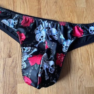 Skull and Bones mens brazillian thong with satin lined gusset and back. Available in size 28”- 38” waist. Also available in other colours