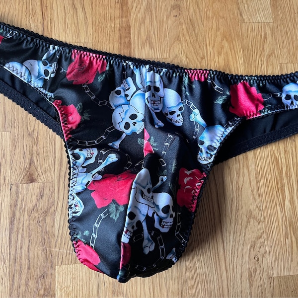 Skull and Bones mens brazillian thong with satin lined gusset and back. Available in size 28”- 38” waist. Also available in other colours