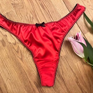 Womens underwear luxury satin red thong, in sizes uk8 - plus size uk22. Add these scarlet red knickers to your sexy lingerie collection.