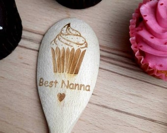 May include: A wooden spoon with a heart and the text "Best Nanna" engraved on it. The spoon also has a small cupcake design engraved on it.