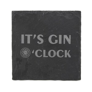 May include: Black slate coaster with the text "IT'S GIN 'CLOCK" and a small graphic of a citrus fruit.
