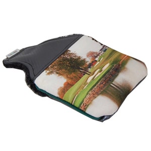 May include: A grey and white golf club head cover featuring a green and brown golf course image. The cover has a black flap with a white logo that says "Club Glove".