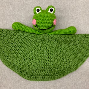 Puede incluir: Manta de seguridad de ganchillo verde con forma de rana con una gran forma de hoja verde redonda de ganchillo.
