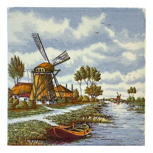 May include: A vintage tile depicting a Dutch windmill with a thatched roof, a small house, and a canal with a boat. The scene is painted in shades of blue, green, brown, and yellow.