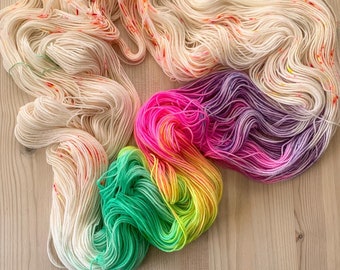 Hand dyed ivory speckled yarn with pastel rainbow | speckled sock yarn | Unicorn Cupcake | pastel rainbow sock yarn