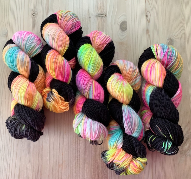 Hand dyed pastel rainbow and black sock yarn Toucan Sam Assigned color pooling yarn image 1