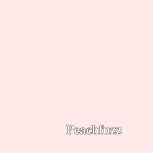 May include: A light pink background with the text "Peachfuzz" in a black outlined font.