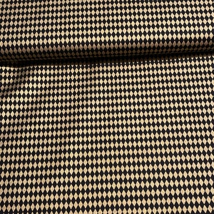 May include: Black fabric with a gold diamond pattern.
