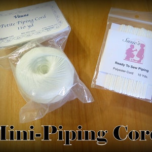 May include: Two packages of white piping cord. The first package is labeled "Vaune Petite Piping Cord 110 yd". The second package is labeled "Susie's Ready To Sew Piping Polyester Cord 10 Yds."