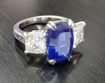 Platinum handmade ring, Cushion sapphire center with princess diamonds