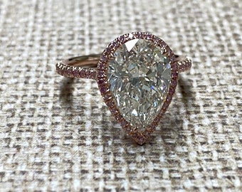 Rose Gold pearshape diamond center ring