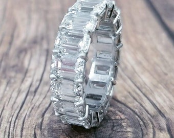 Platinum eternity band with emerald cut diamonds
