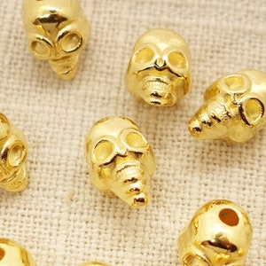 Skull beads; Mystical metal beads; Halloween Intermediate Beads Spacer | DQ METAL gold-plated | 9 x 7 mm | Color: Gold | 1 piece