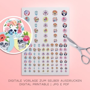 May include: Printable sheet of colorful round stickers featuring sugar skulls with floral crowns. The sheet includes a variety of colors and designs, including pink, blue, yellow, and green. The text on the sheet reads "Digitale Vorlage zum selber Ausdrucken Digital Printable | JPG & PDF".