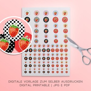 May include: Printable digital sheet of 60 round stickers featuring a red strawberry with green leaves on various backgrounds. The backgrounds include black and white polka dots, red, light blue, and cream. The sheet is labeled "Digitale Vorlage zum Selber Ausdrucken Digital Printable | JPG & PDF".