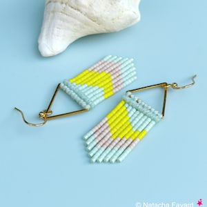 May include: A pair of gold triangle dangle earrings with light blue, pink, and yellow beaded fringe.