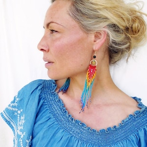 Long beaded fringe earrings with macaw parrot feather colors blue red yellow