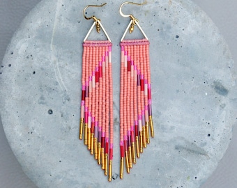 Long beaded fringe earrings in shade of salmon pink and red