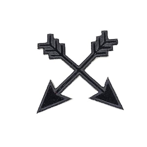May include: Black embroidered patch with two crossed arrows pointing in opposite directions.