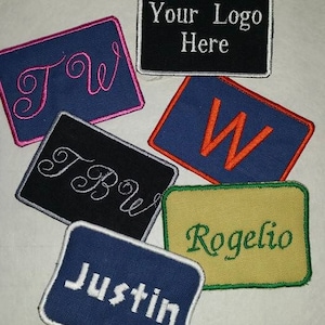 May include: Six embroidered patches with different designs and colors. The patches include the words "Your Logo Here", "Justin", "Rogelio", "Tow", "Brown", and a capital "W".