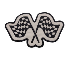 May include: A white embroidered patch with two black checkered flags crossed in the center.