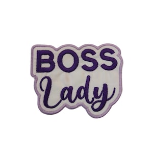 May include: Purple embroidered patch with the text "BOSS Lady" on a white background.